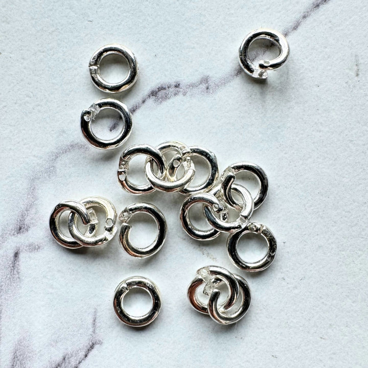 Double Lock Jump Rings, 7mm, Solid silver plated brass, Sold as 20 pieces.